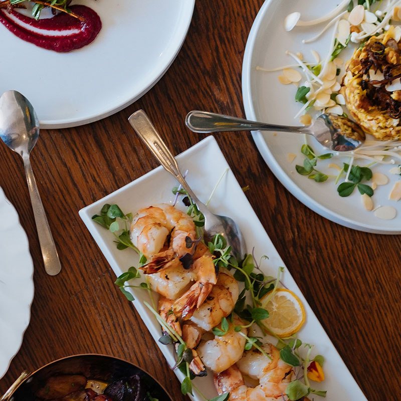 An overhead view of plates of seafood